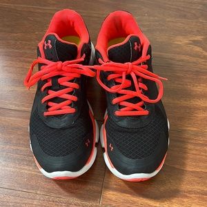 Under Armor women’s black and neon coral training shoes
